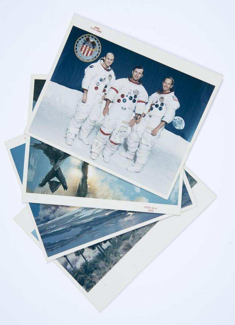 4 NASA Apollo 16 Mission Photographs: DESCRIPTION: Four NASA Apollo XVI mission glossy photographs of launch and crew members. Each are chromogenic prints on fiber-based Kodak paper with 'A Kodak Paper' watermark on verso. Includes red se