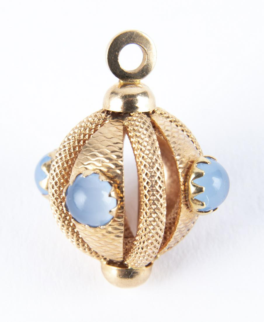 18k Moonstone Ball Pendant: DESCRIPTION: 18k ball pendant set with moonstone cabochons. Marked "UNO-AR 750". MEASUREMENTS: 3.2 dwt (5 gr). 3/4" long. CONDITION: Very light wear.