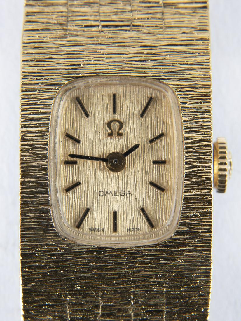 Omega 17 Jewel Gold Plated Wrist Watch: DESCRIPTION: Omega seventeen jewel unadjusted wristwatch with twenty microns gold plated case. MEASUREMENTS: 3/4" lug to lug. CONDITION: Running. Light wear to band.