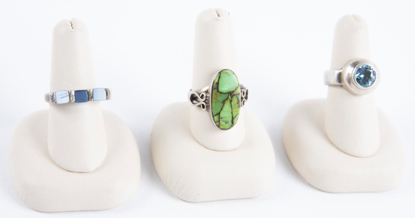 3 Silver Rings incl Sterling: DESCRIPTION: Three silver rings with stones. Two marked 925. MEASUREMENTS: Sizes 6.25 to 8. CONDITION: Light wear to silver.