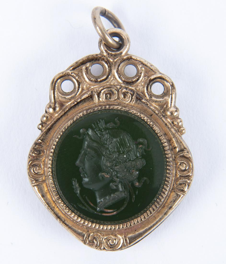 Victorian Gold Filled Intaglio Fob: DESCRIPTION: Victorian gold filled glass intaglio fob. MEASUREMENTS: 1-1/4" x 1". CONDITION: Light wear.