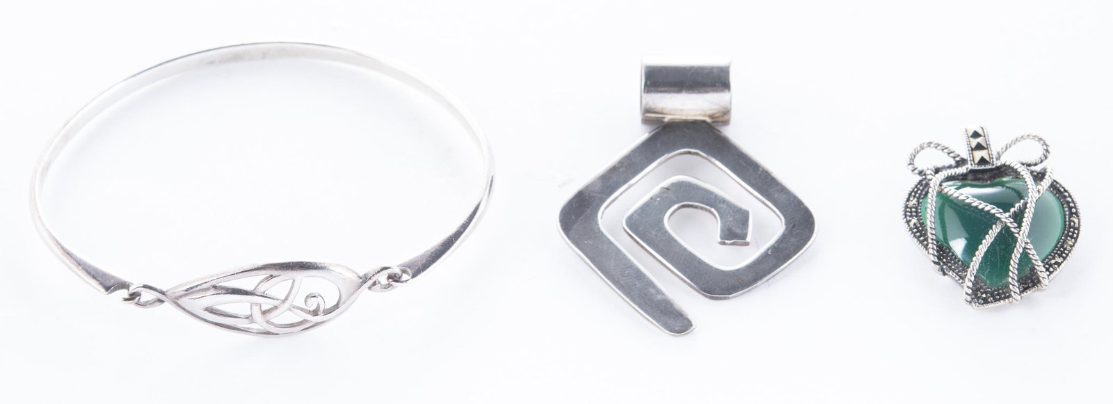 3 Pcs Sterling Jewelry: DESCRIPTION: Three pieces sterling jewelry. Includes cuff bracelet, modernist pendant, and heart pendant with green glass and marcasite. All stamped 925. MEASUREMENTS: Pendants 1-1/2" to 2. Bracelet t