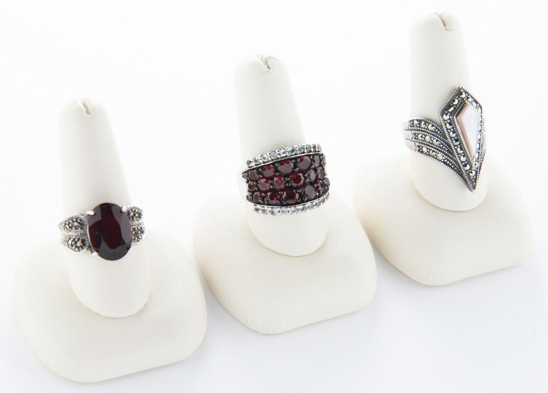 3 Sterling Rings: DESCRIPTION: Three sterling rings including garnet and marcasite. MEASUREMENTS: Sizes 7-1/2" to 8.25. CONDITION: Light wear.