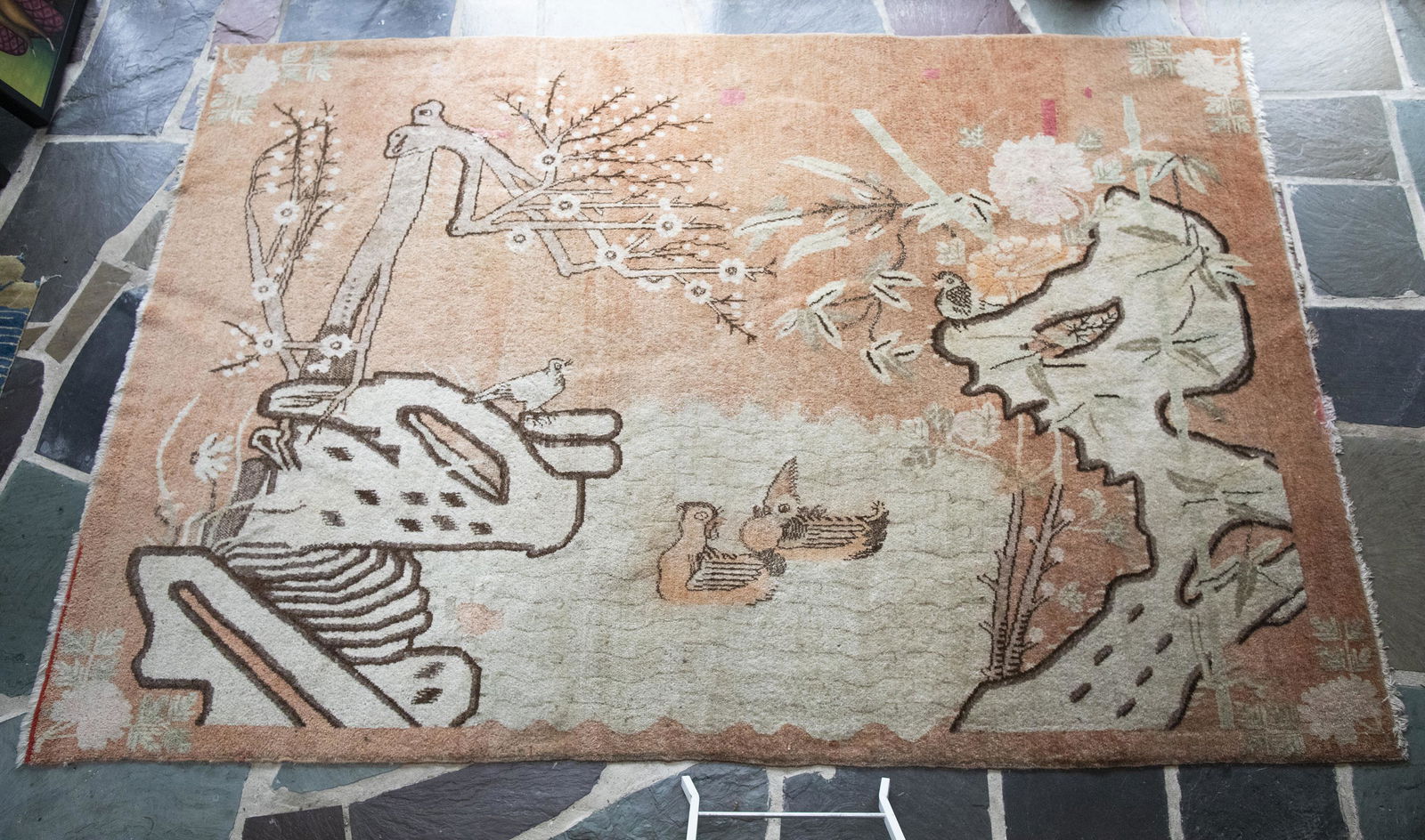 Samarkand Area Rug: DESCRIPTION: Samarkand area rug. Salmon ground with brown and cream pond and ducks. Central Asia, 1950's. MEASUREMENTS: 5' 10" x 9'. CONDITION: Old repairs with wear to edges.