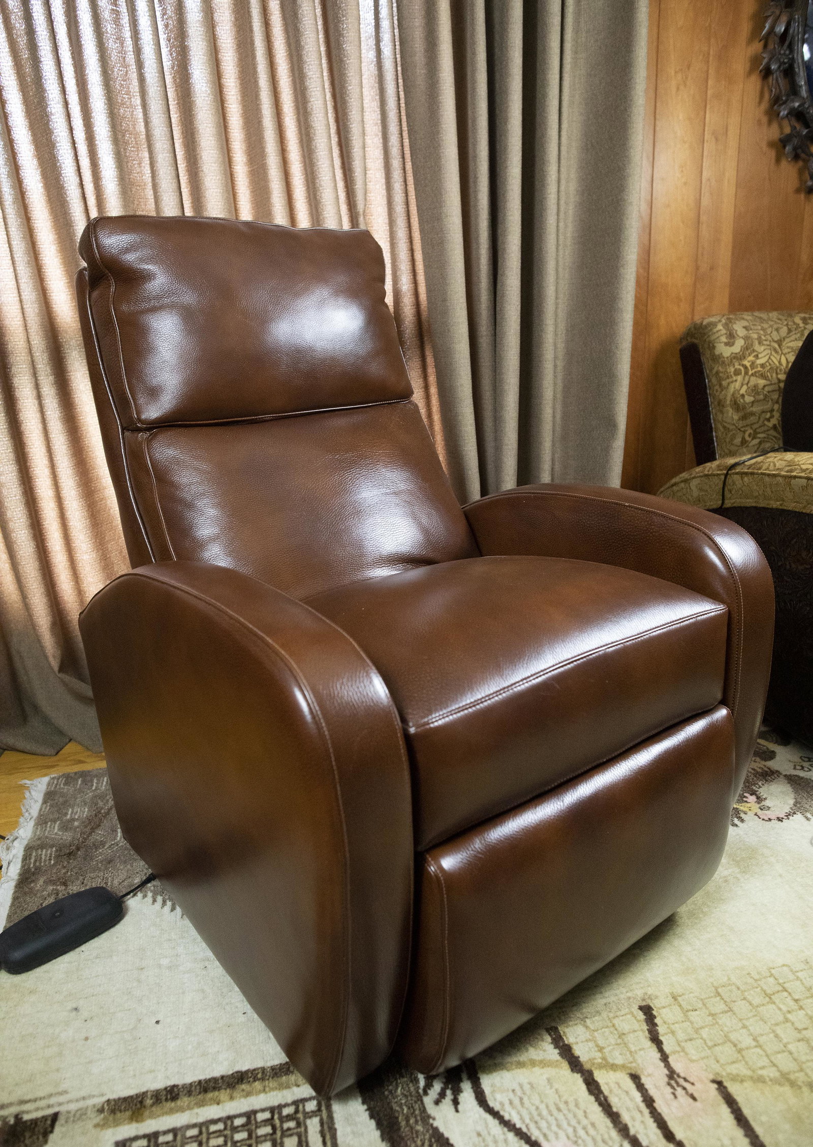 Brown Leather Recliner by Ciar: DESCRIPTION: Brown leather recliner by Ciar. Electric. MEASUREMENTS: 29" wide x 32" deep x 40" high when upright. CONDITION: Works. Excellent. No defects noted.