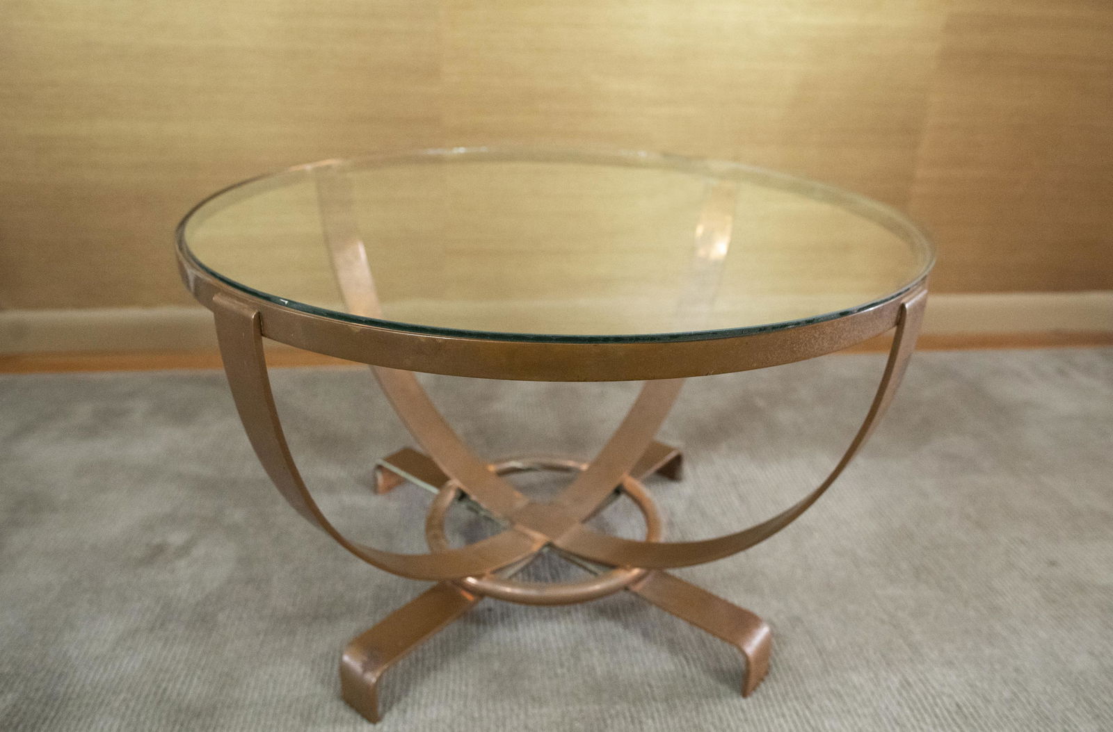 Art Deco Glass Top Coffee Table: DESCRIPTION: Art Deco glass top coffee table with spherical copper base. MEASUREMENTS: 27" diameter x 18" high. CONDITION: Areas of patina to copper.