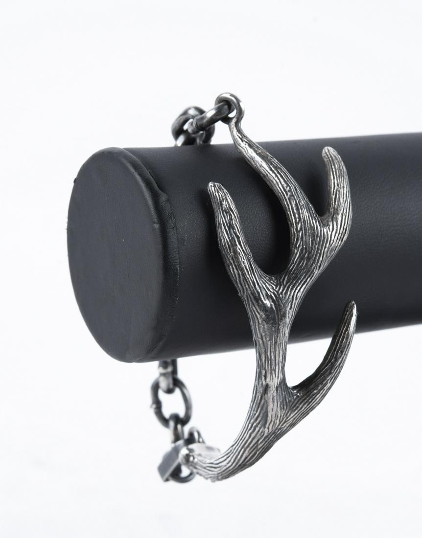 Sterling King Baby Antler Bracelet: DESCRIPTION: Sterling King Baby antler bracelet. Marked "King Baby 925 USA". MEASUREMENTS: 6" long. 1.61 ozt. CONDITION: Light wear to silver. In original bag.