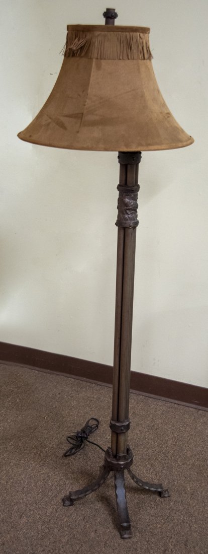 Metal Stag Floor Lamp: DESCRIPTION: Painted brass floor lamp with stag decorated straps. With grey and taupe linen shade. MEASUREMENTS: 59" high x 20" wide. CONDITION: No defects noted.