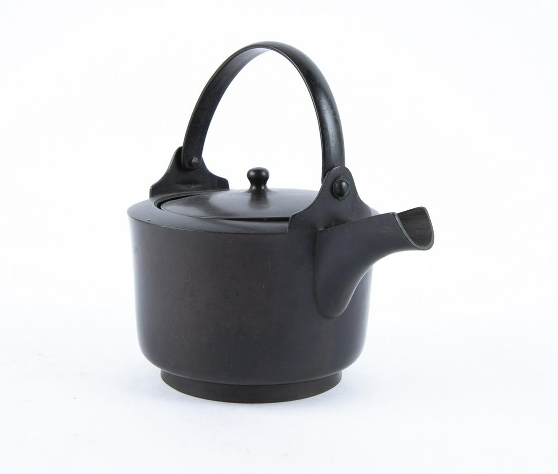 Japanese Cast Bronze Teapot: DESCRIPTION: Japanese cast bronze teapot. Round form with swing bail handle. MEASUREMENTS: 6" x 9". CONDITION: Wear consistent with use including surface wear and dings.