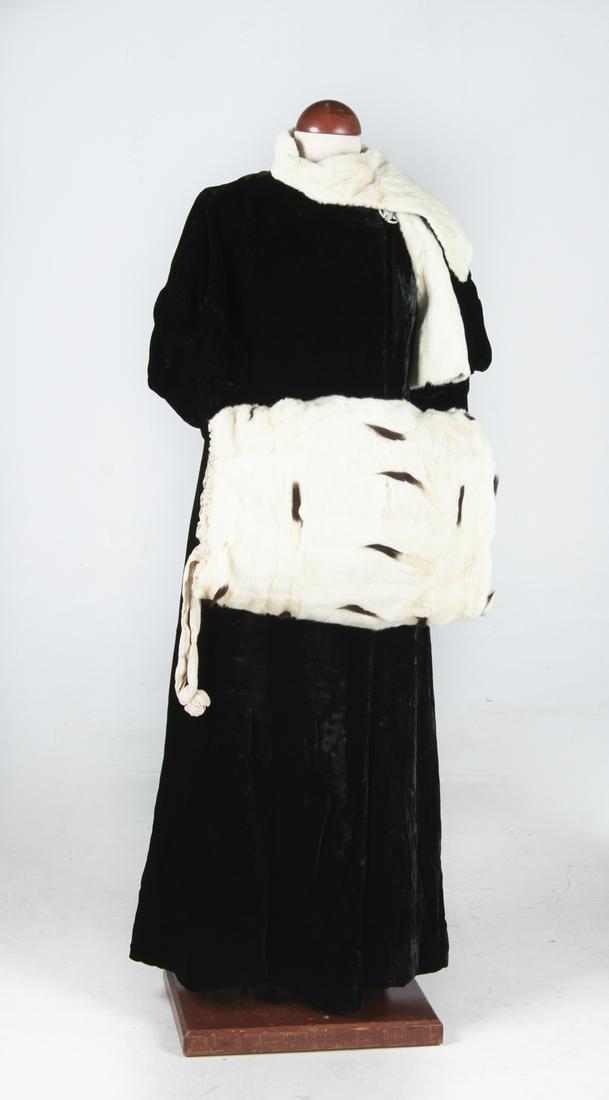 Blums North Black Velvet Coat with Ermine Fur Muff: DESCRIPTION: Blum's North black velvet coat with attached white ermine fur scarf and ermine fur hand muff. Circa early 20th century. Full length coat labeled "Blum's-"North" Chicago Paris". Features t