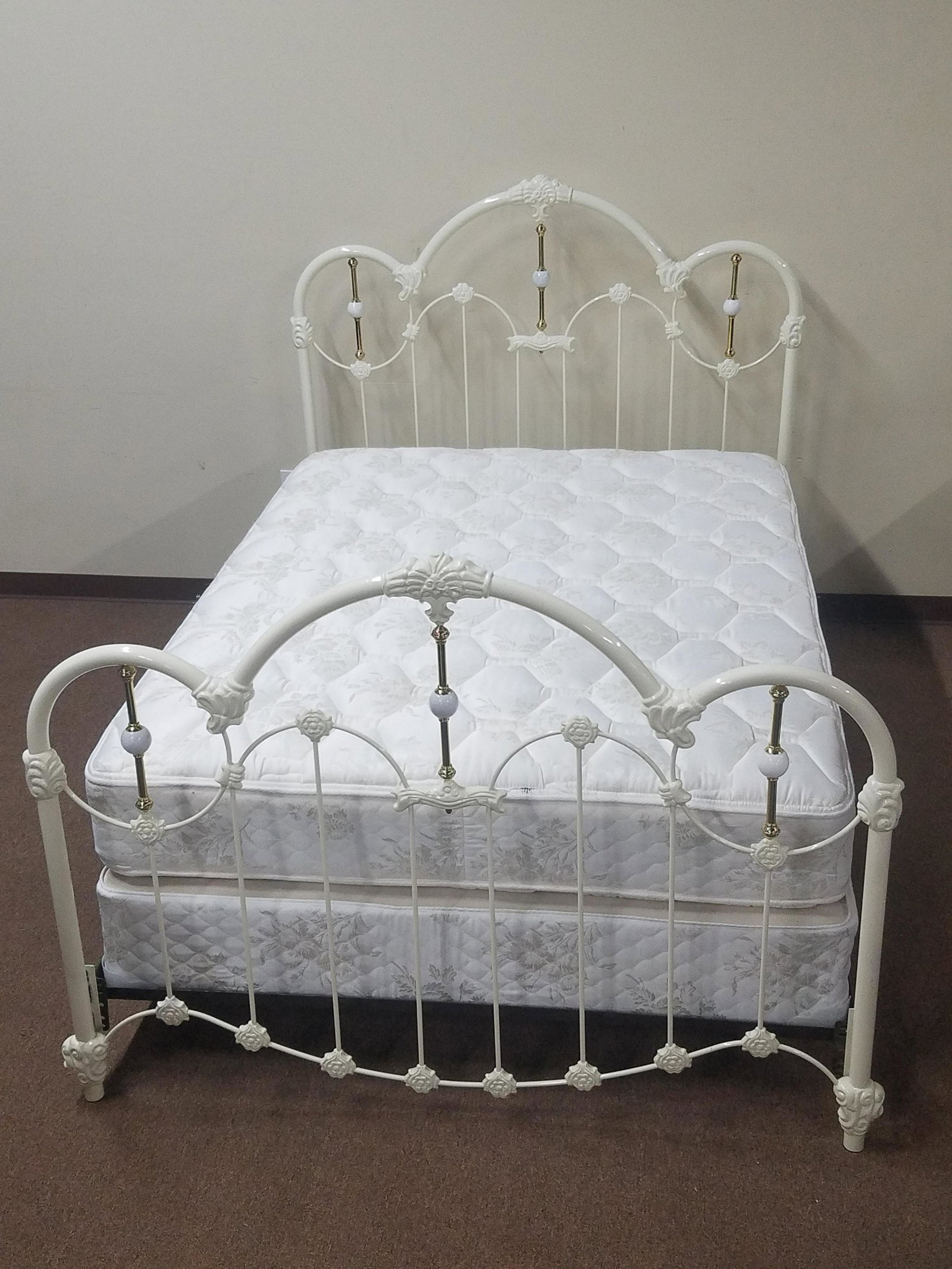 White Iron Bed with Mattress and Box Spring: 62" wide x 88" deep x 58" high. Includes Sealy Posturepedic mattress and box spring.