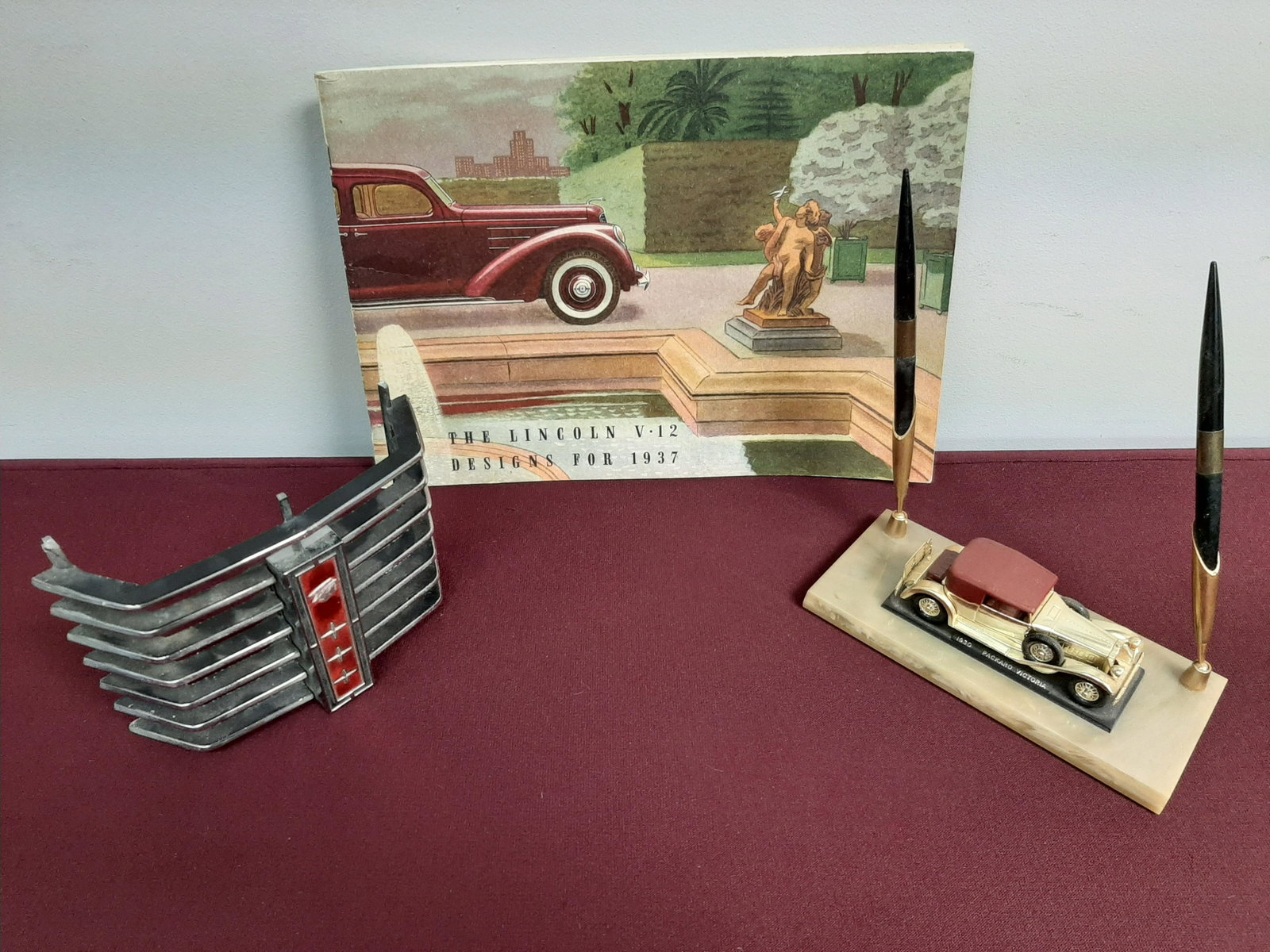 3 Pieces Incl. Car Grill and Pen Holder: Also includes the 1937 Lincoln V12 design book