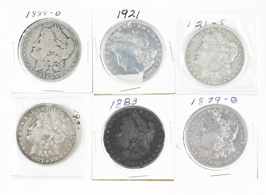 6 Morgan Silver Dollars: DESCRIPTION: Four Morgan silver dollars including 1883, 1879-O, 1889-O, 1921 P D and S. Good-X Fine.