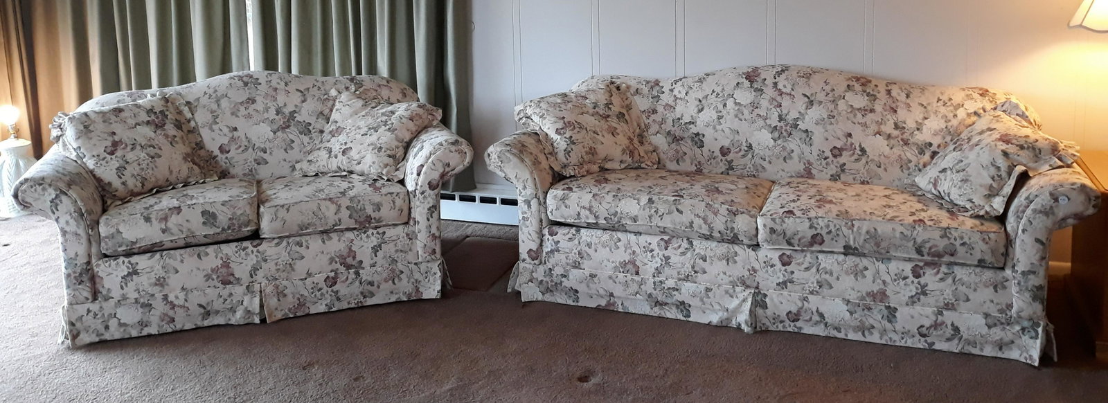 Klaussner Sofa & Loveseat: Camelback sofa and love seat. Floral upholstery. Sofa 84" wide x 34" deep x 33" high. Love seat 62" wide x 33" deep x 33" high. Surface wear to upholstery.
