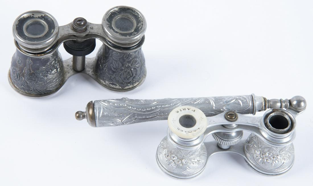 2 Repousse Opera Glasses, 20th C.: DESCRIPTION: Two pairs of repousse opera glasses. 20th century. Includes: 1) Lamier chased pewter opera glasses with floral decoration to binoculars and handle. Mother-of-pearl eye rings marked "LAMIE