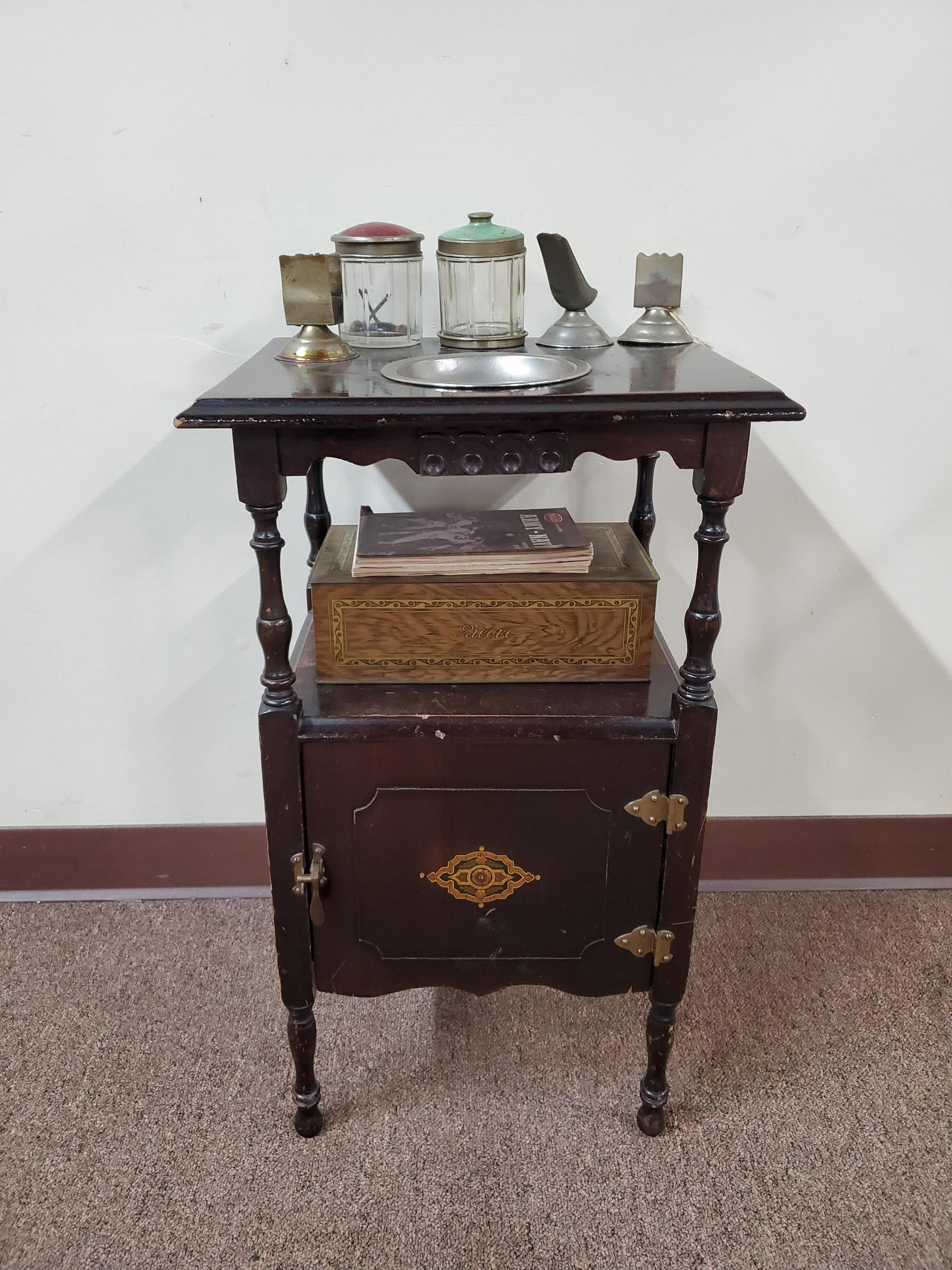 10 Pc Smoking Stand Set: Includes (4) Phillies Presents Guides, tin humidor, 2 tobacco jars and matchbook holders. 15-3/4" wide x 12-3/4" deep x 29-1/4" high. Scratches to wood.