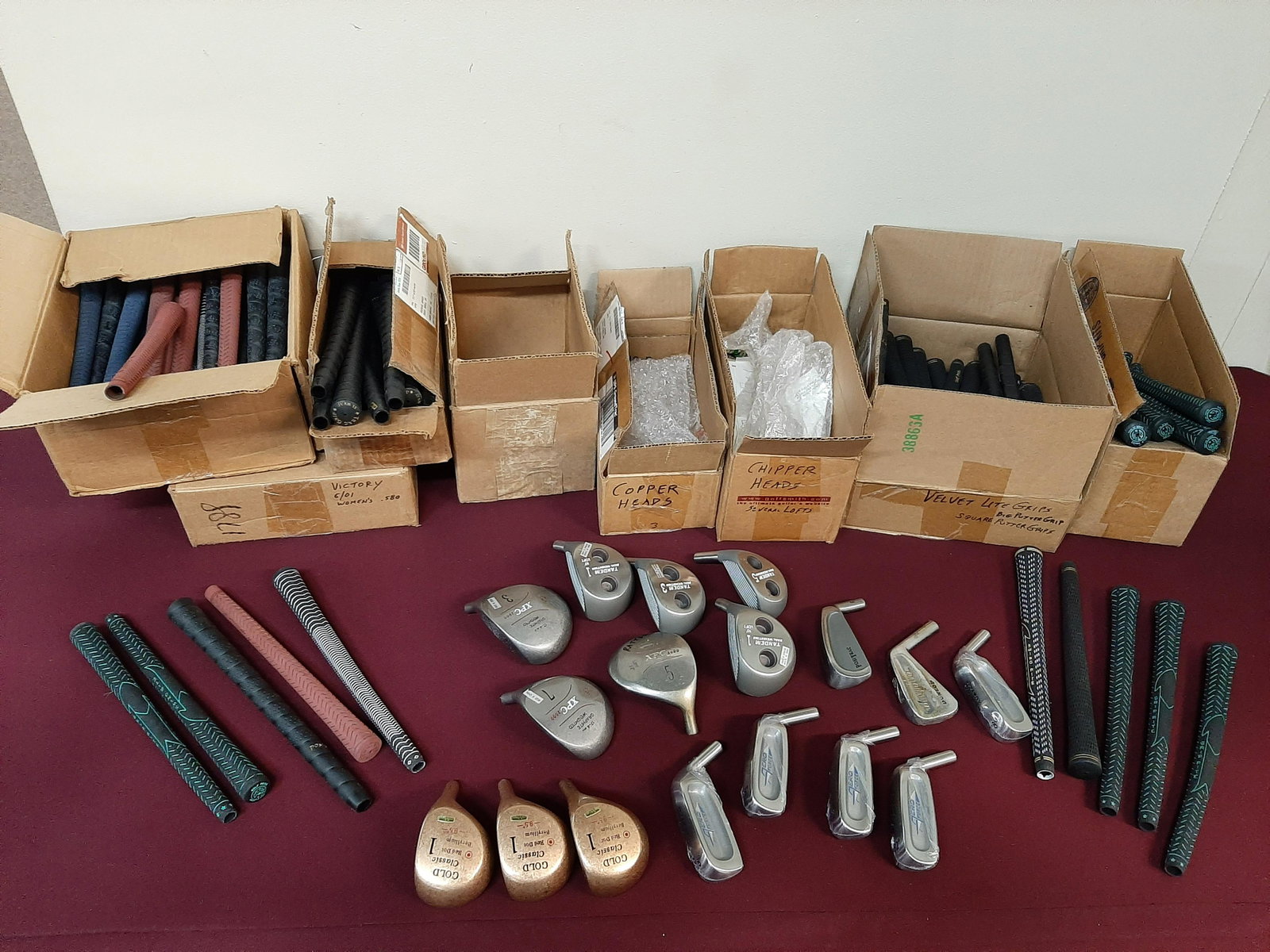 Collection of Golf Club Parts: Unused. Includes 5 Spalding Custom iron heads (various lofts), 1 Dunlop iron head, 1 PosiTrac chipping iron head, 3 Gold Classic Red Dot 9.5° driver heads, 4 Tandem Dual Weighting wood heads, 3 XPC 2