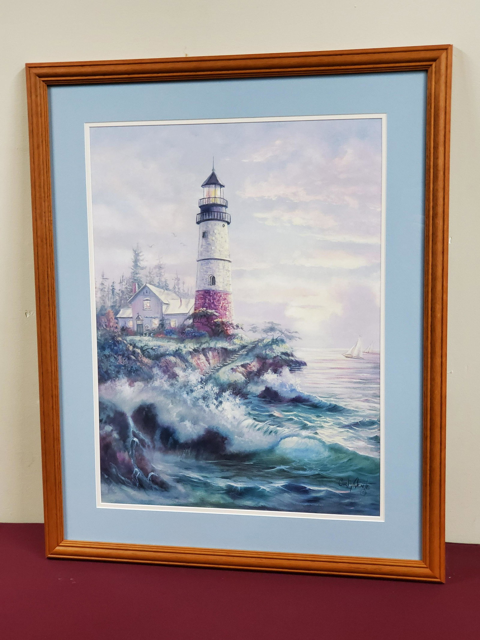 Carl Valente Lighthouse Print: Signed Carl Valente. Overall with frame 25-1/4" wide x 31" high.