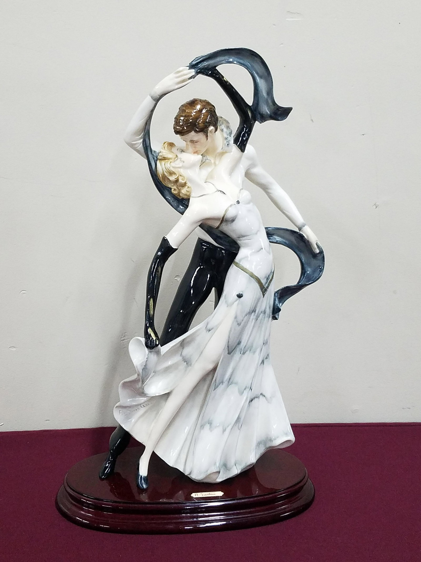 A. Santini Dancing Figurine: 11-1/2" wide x 19-1/4" high.