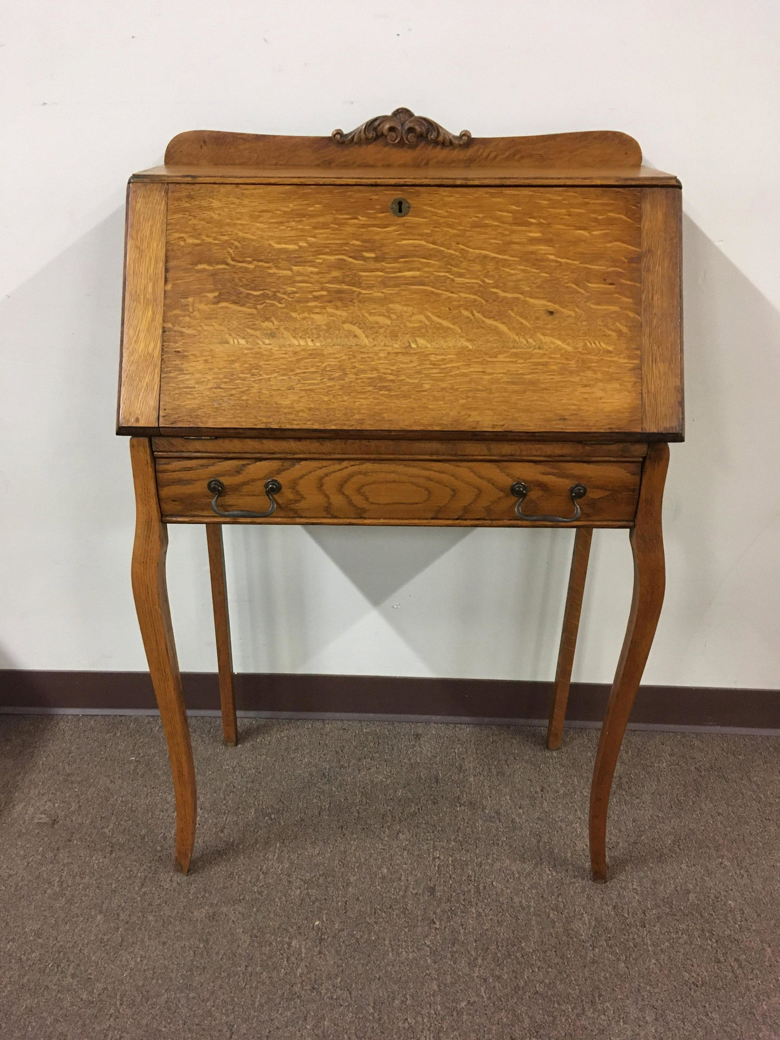 Oak Writing Desk: 27 wide x 14-1/4 deep x 43-1/2 high. Split to wood inside of drawer. No key.