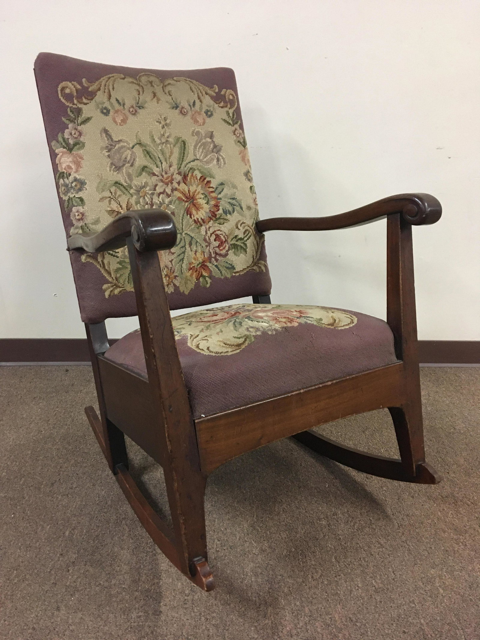 Antique Needlepoint Rocker: 24-3/4 wide x 31-1/2 deep x 40 high. Losses to fabric of seat.