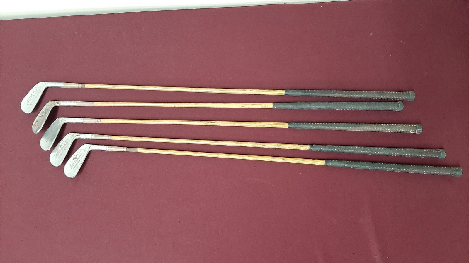 5 Spalding Wood Shaft Golf Clubs: Includes 2, 3, 4, 5, and 8 iron.