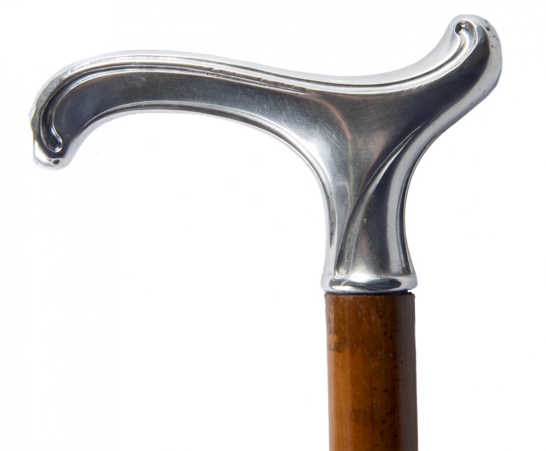 German 800 Silver Handled Walking Cane: DESCRIPTION: Post-1886 German 800 silver handled walking cane. Wood shaft and metal heel. Marked "Geschutzt 800" with Halbmond und Krone and possible Wilhelm Muller maker's mark. MEASUREMENTS: Cane 35