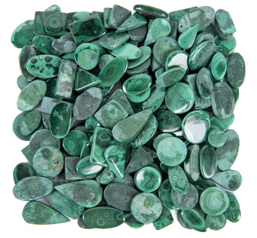 172 Pcs Malachite Cabochons: DESCRIPTION: One hundred and seventy-two pieces malachite cabochons. MEASUREMENTS: Ranges from 3/4" to 1" long. CONDITION: No defects noted.