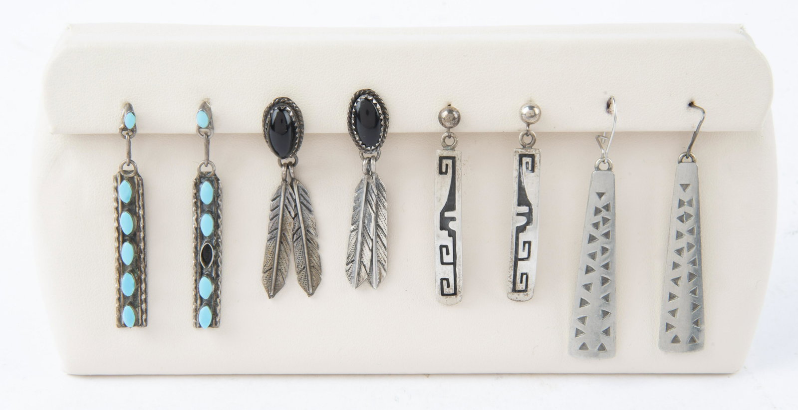 4 Pairs Earrings incl Georg Jensen: DESCRIPTION: Four pairs silver earrings including turquoise and onyx. Longest pair with triangle design marked "Georg Jensen Pewter". MEASUREMENTS: 1-1/2" to 1-3/4" long. CONDITION: One turquoise ston
