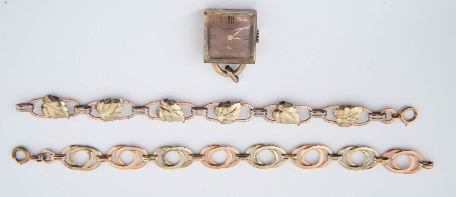 3 Multi-Colored GF Bracelets & Pendant Watch: DESCRIPTION: Three pieces multi-colored gold filled jewelry including two bracelets and Crawford pendant watch. MEASUREMENTS: Bracelets 6-1/2" to 7" long, watch 1" x 1". CONDITION: Bracelets with ligh
