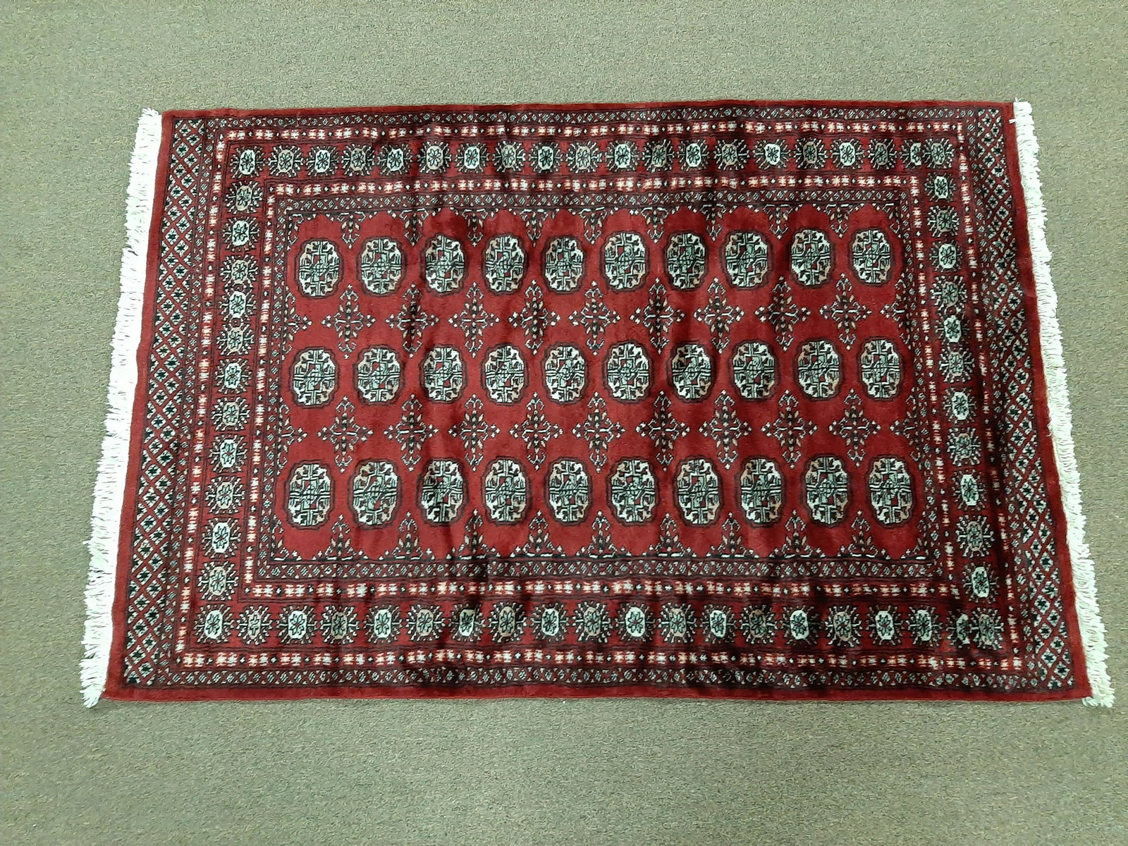 Area Rug: 6' long X 4' wide. Hand woven.
