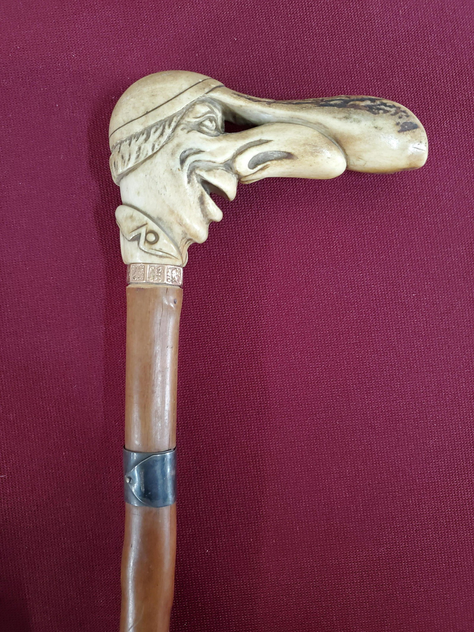 Carved Antler Cane with 14k Band and Sterling: 35" long. Sterling band marked H.S. Pearson 1774-1924
