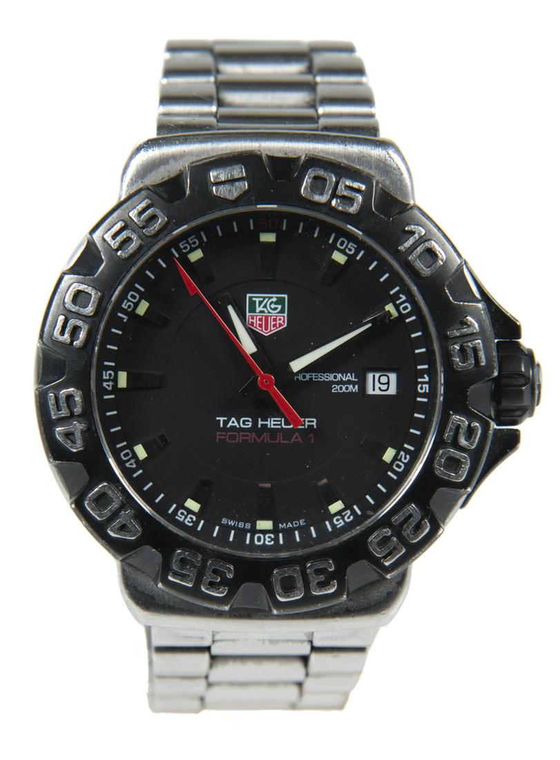 Tag Heuer Formula One Men's Wristwatch in OB: DESCRIPTION: Tag Heuer Formula One wrist watch in original box. Model WAH1100 JV 8884. Stainless steel case with black titanium bezel on stainless bracelet. Features water-resistance, screw-in crown,