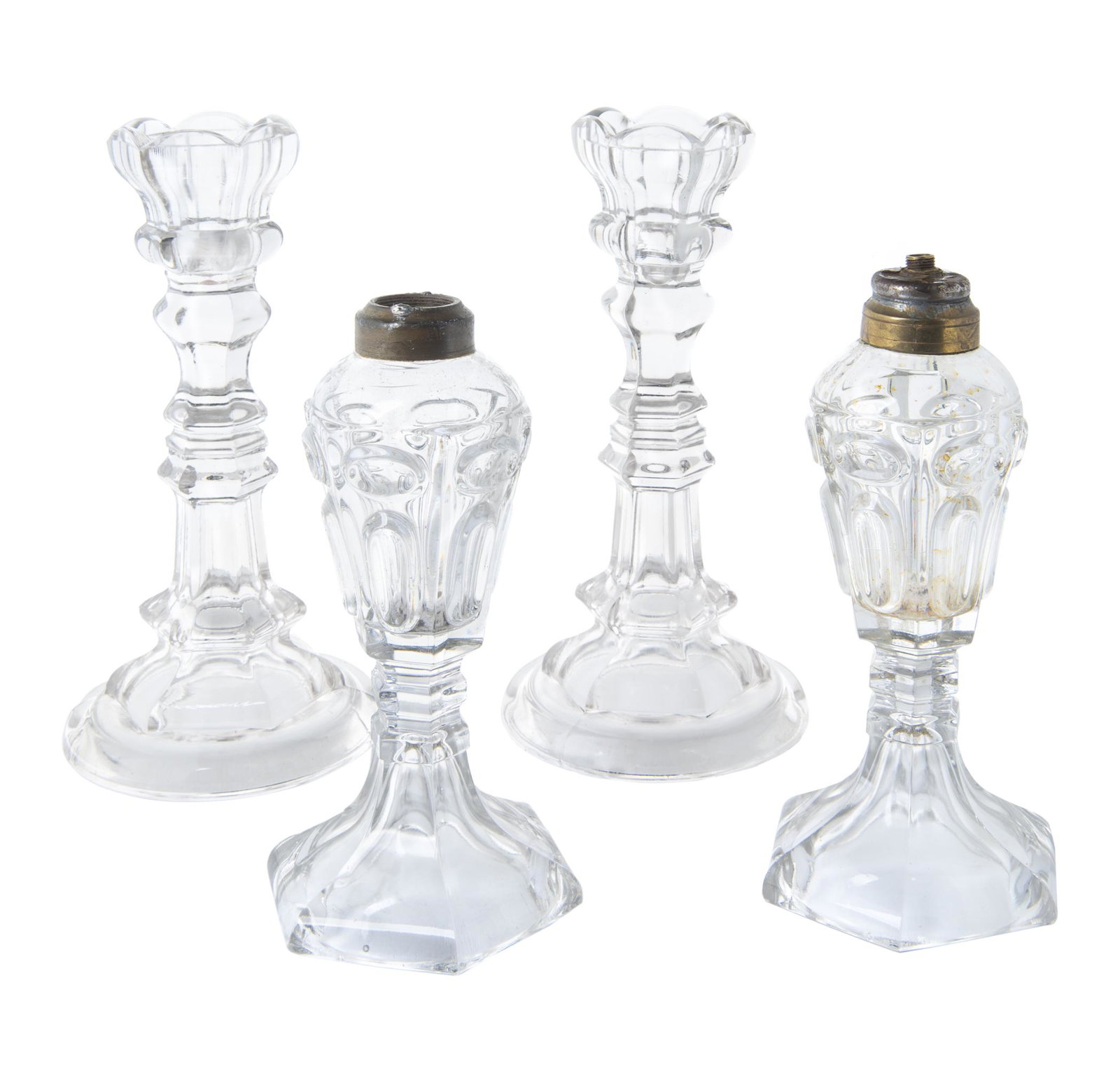 4 Pcs Flint Glass Lamps & Candlesticks: DESCRIPTION: Four pieces of flint glass. Includes pair of 8" oil lamps and a pair of 10" petal top two mold candlesticks. MEASUREMENTS: See description. CONDITION: Light wear and cracking to interior 