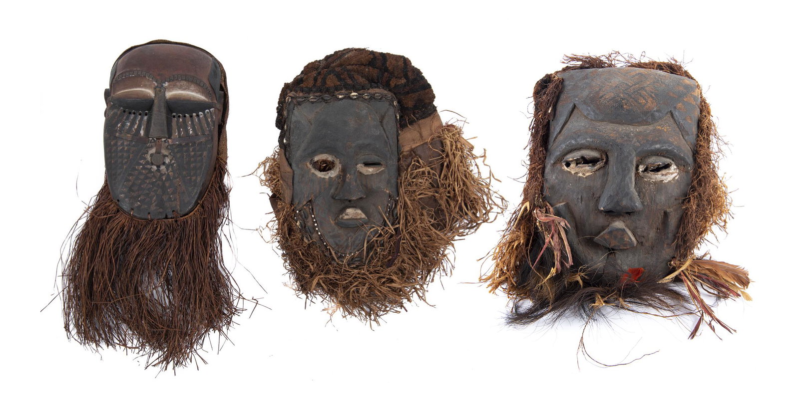3 African Kuba Dance Masks with Raffia Beards: DESCRIPTION: Three African Kuba dance masks. Kuba people, Democratic Republic of Congo, 20th century. Hand carved wood mask with polychrome paint to face with stiffened woven backs. Includes: 1) Raffi