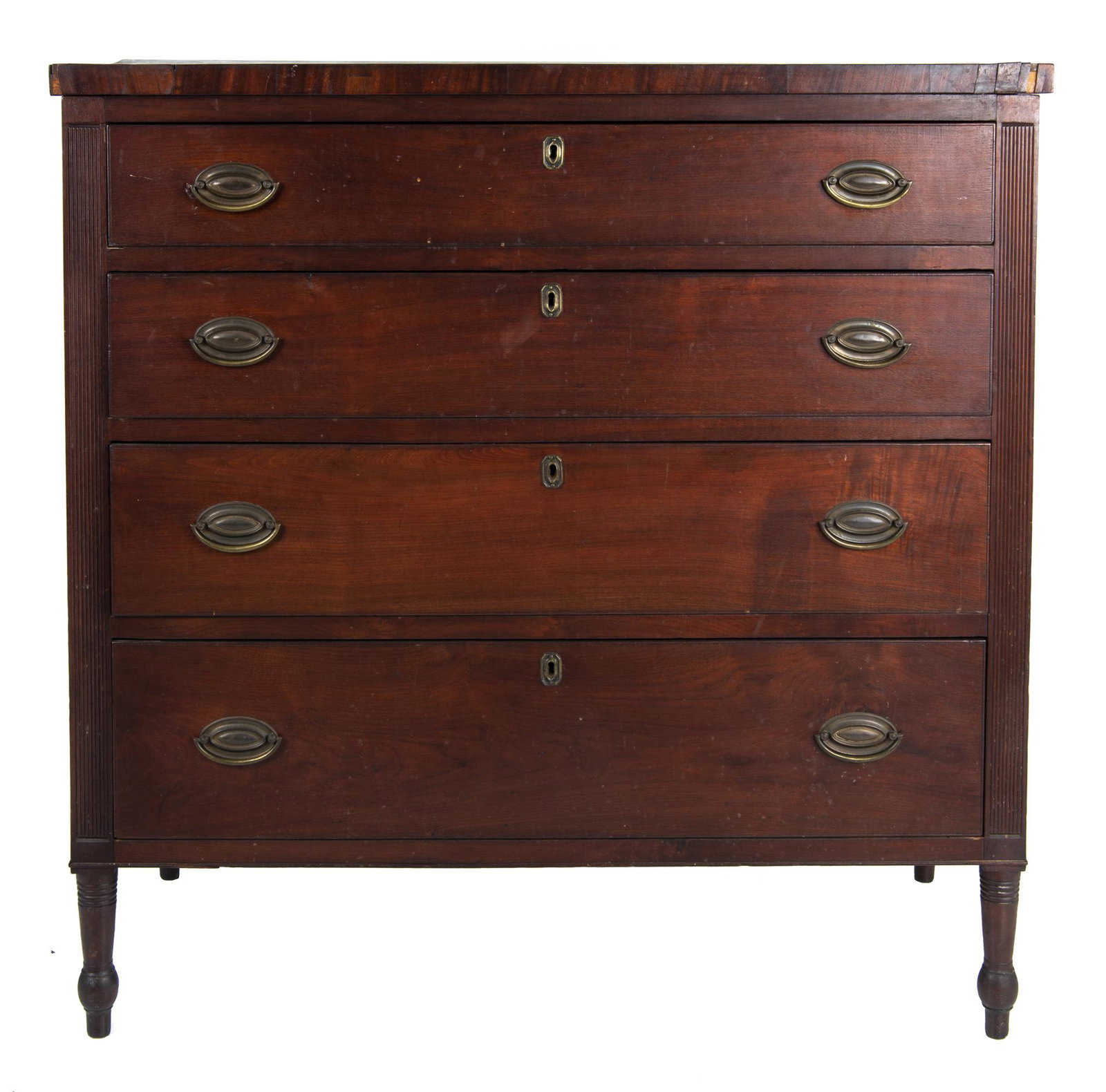 Sheraton Chest of Drawers: DESCRIPTION: Walnut Sheradon chest of drawers. With four drawers, brass escutcheons and handles, and reeded stiles. MEASUREMENTS: 40-1/2" wide x 20" deep x 41" high. CONDITION: Crack to top. Light wea