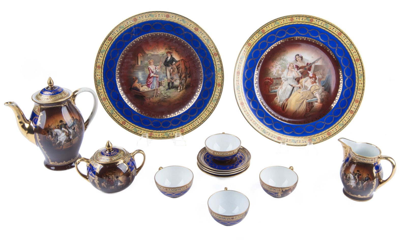 13 Pc Cobalt & Gilt Figural Tea Set: DESCRIPTION: Thirteen piece cobalt and gilt figural tea set. Each marked to bottom. Includes two 11" Heinrich & Co. Selb Bavaria dinner plates. Royal Vienna pieces include four 4-1/4" saucers, four 1-