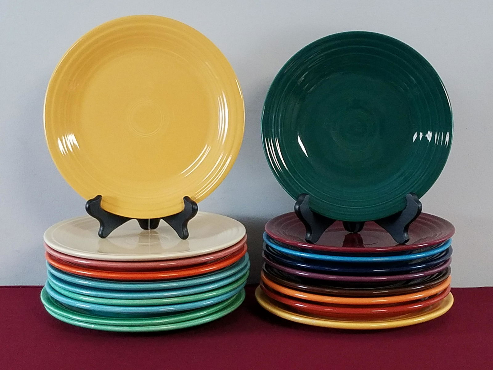 19 Fiestaware Plates: Various stamps. 9" to 9-1/2" diameter.