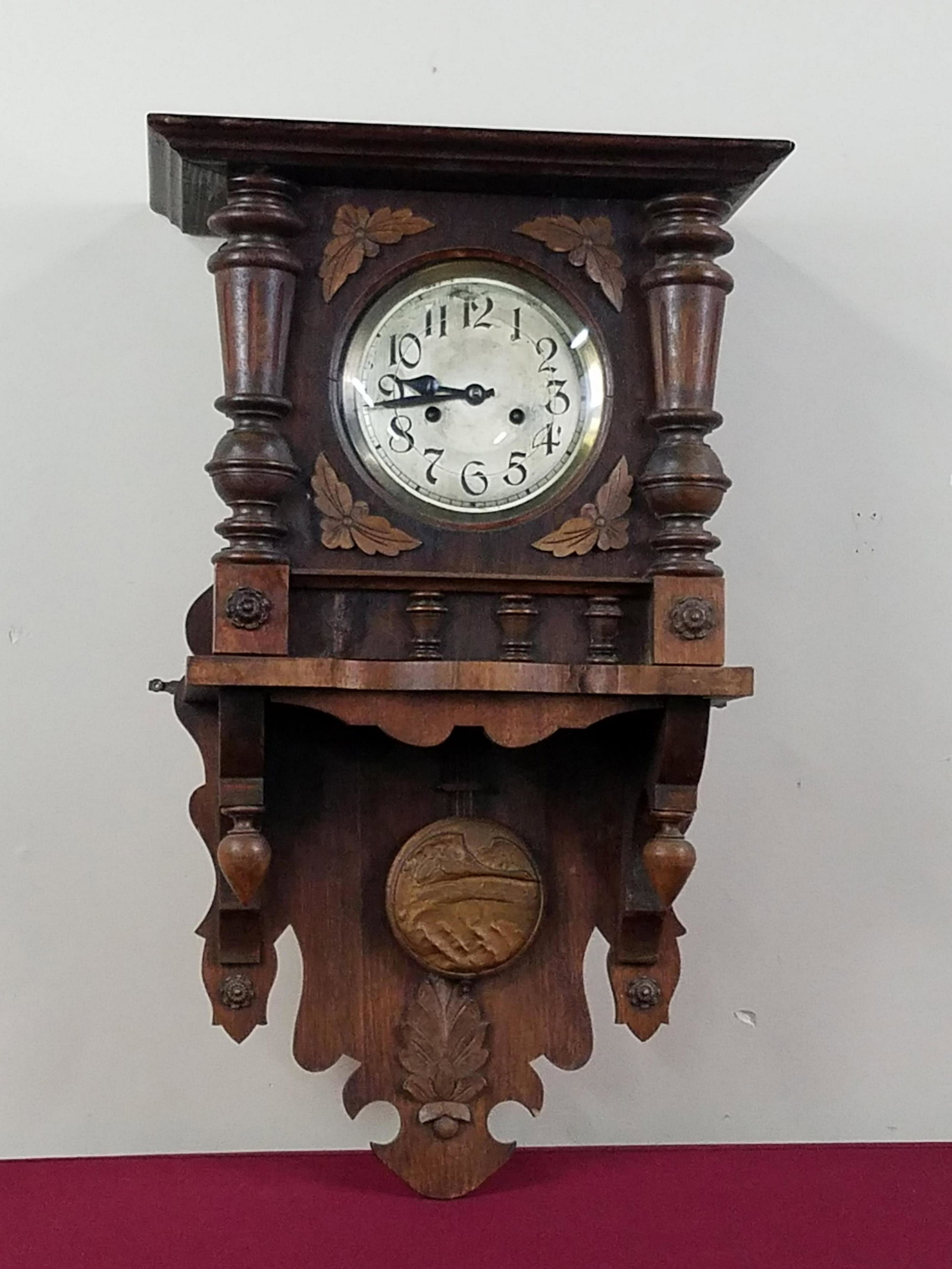 Antique Hurra Wall Clock: Working. 16-1/2" wide x 7-1/2" deep x 27-1/2" high. Some scratches and repairs to wood frame.