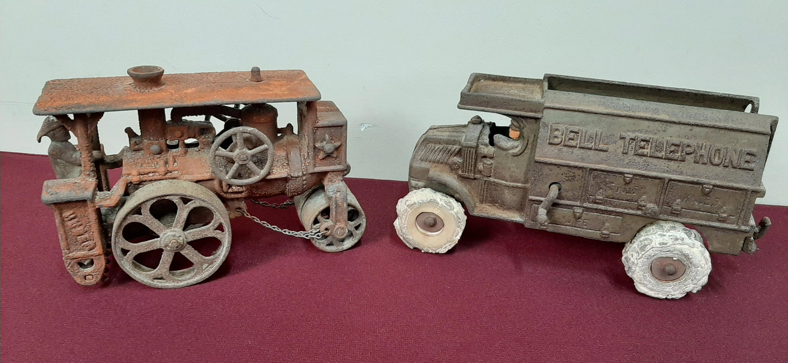 2 Cast Iron Trucks. Incl. Bell Telephone: Also includes Huber tractor. 7 1/2" to 10" long X 5" high.