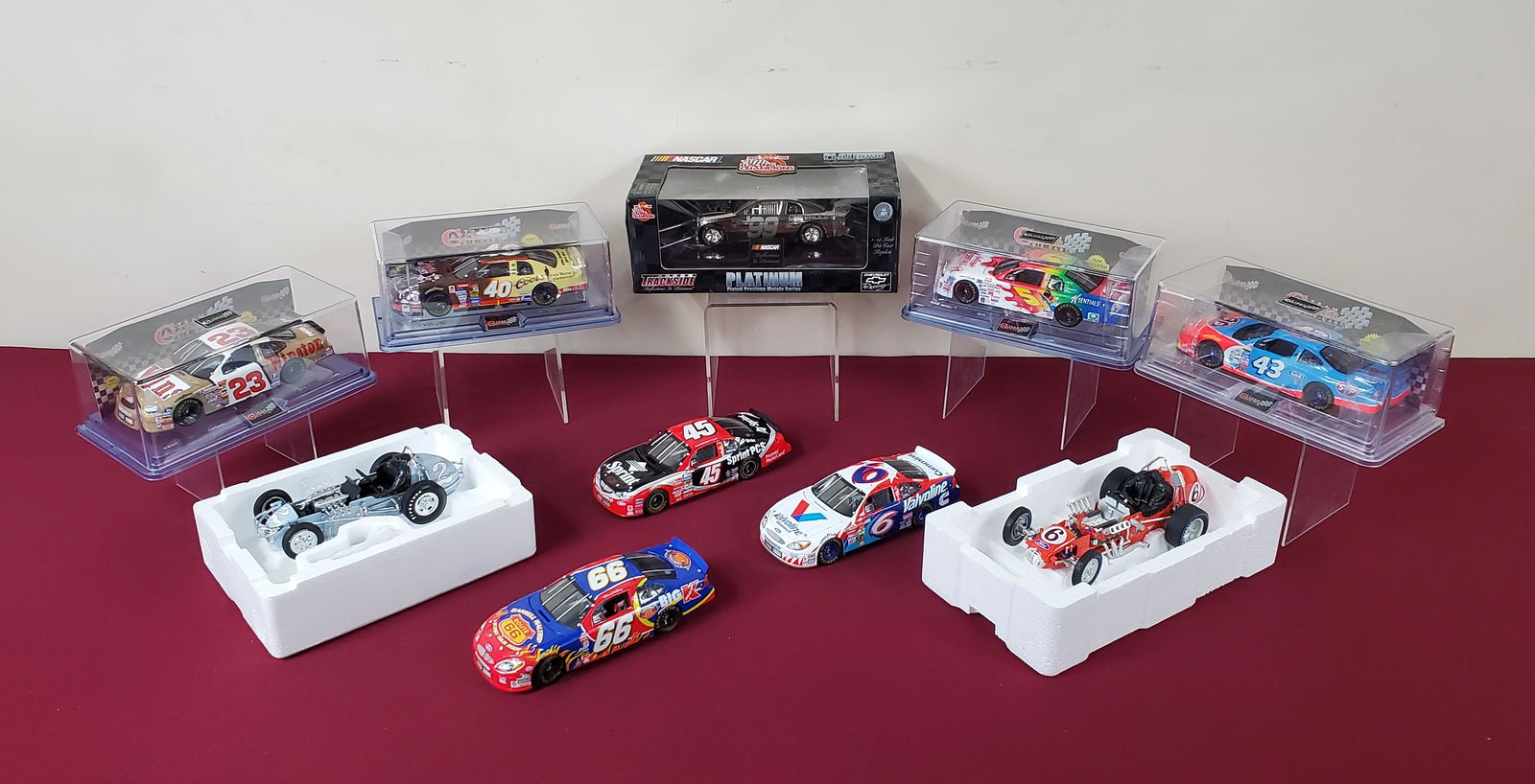 10 Die Cast Cars: 1:24 scale. Includes Team Caliber, Racing Champions and The Vintage Series. All with original boxes. Some factory sealed.