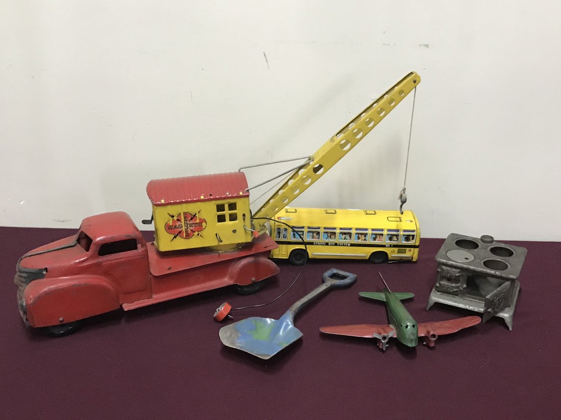 5 Tin Toys: 4 1/4" to 15 1/4" long. Crane 14 1/2" high. School bus made in Japan.