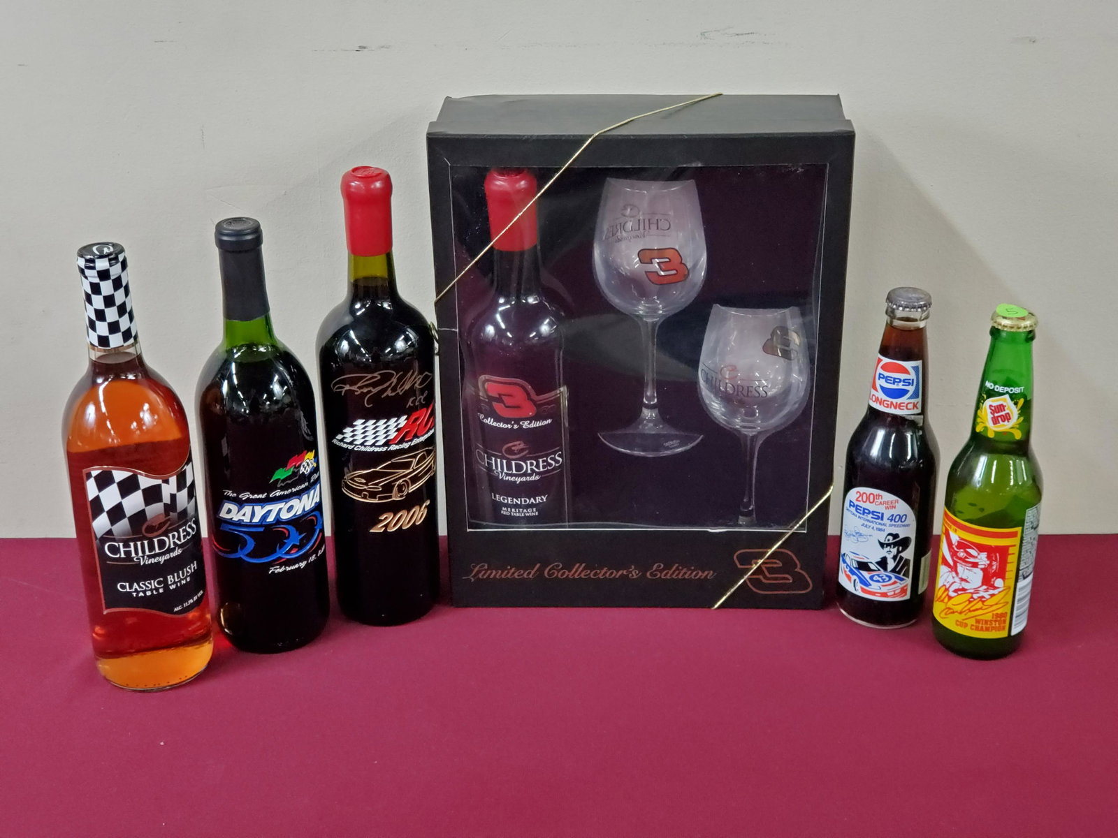 6 Bottles of Estate Wine and Soda: Sodas include: Pepsi 400 and Dale Earnhardt Sun Drop. Wine includes Childress Vineyards.