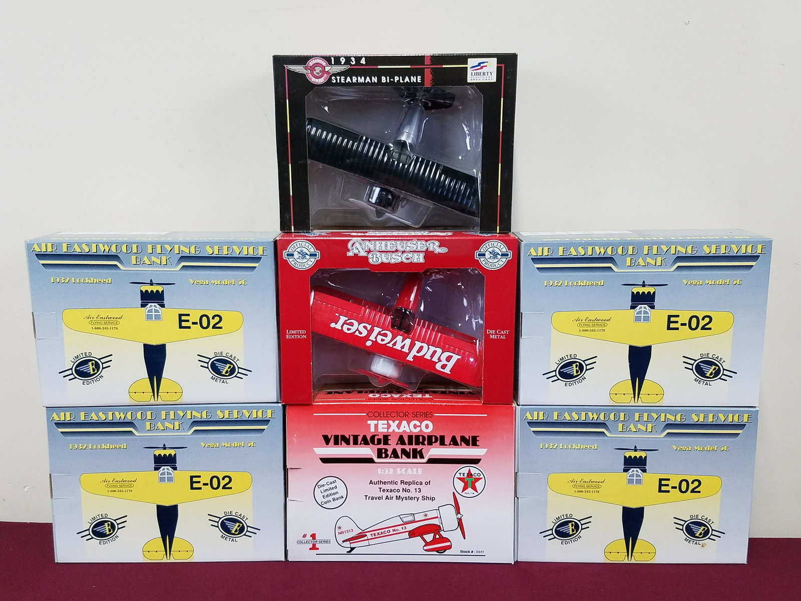 7 Die Cast Planes and Plane Banks: All with original boxes. All 1: 32 scale.