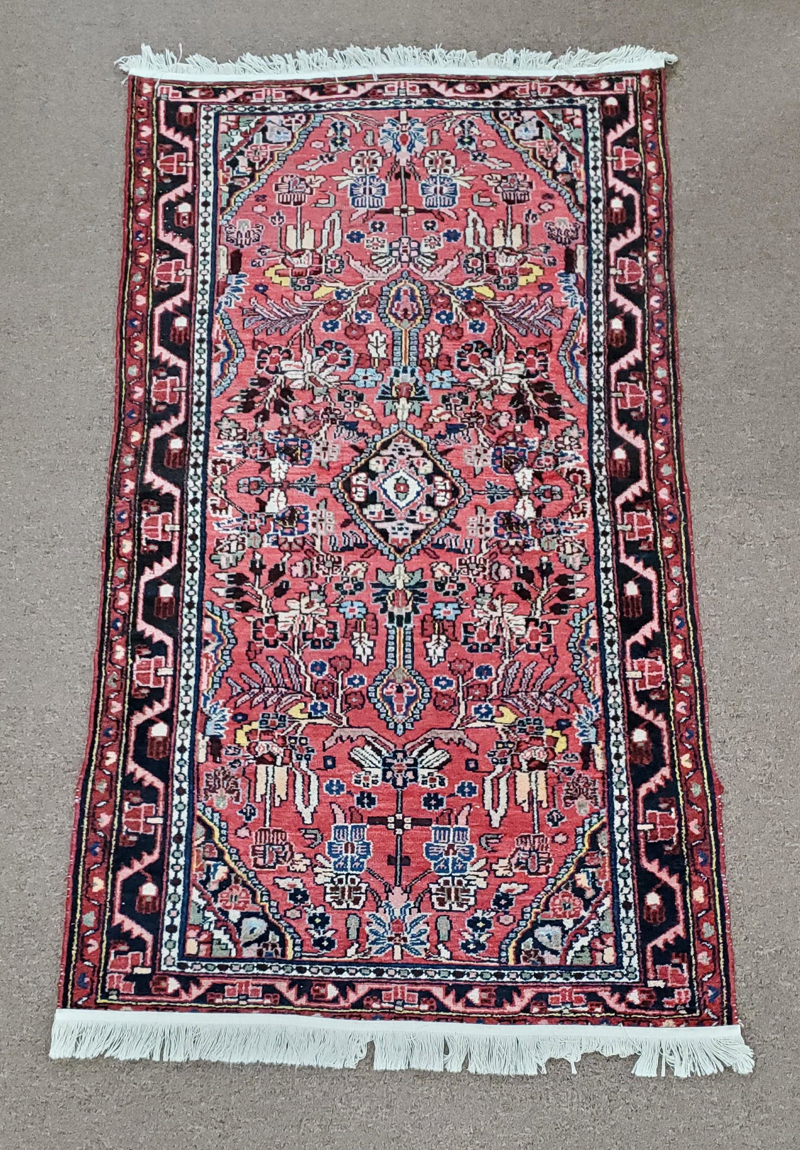 Area Rug: 6'6" long x 3'6-1/2" wide. Hand woven. Made in Iran.