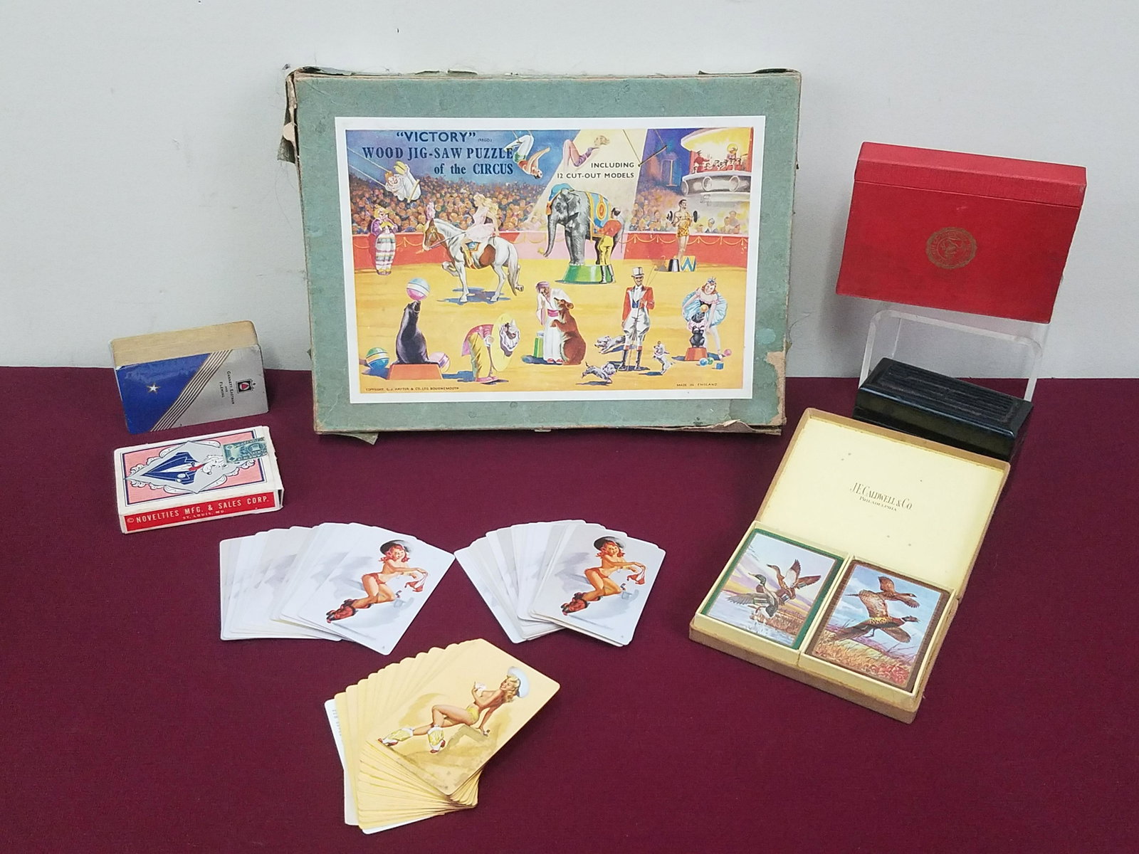 10 Decks of Cards and "Victory Jig-Saw Puzzle: Also includes travel, nude and wildlife playing cards.