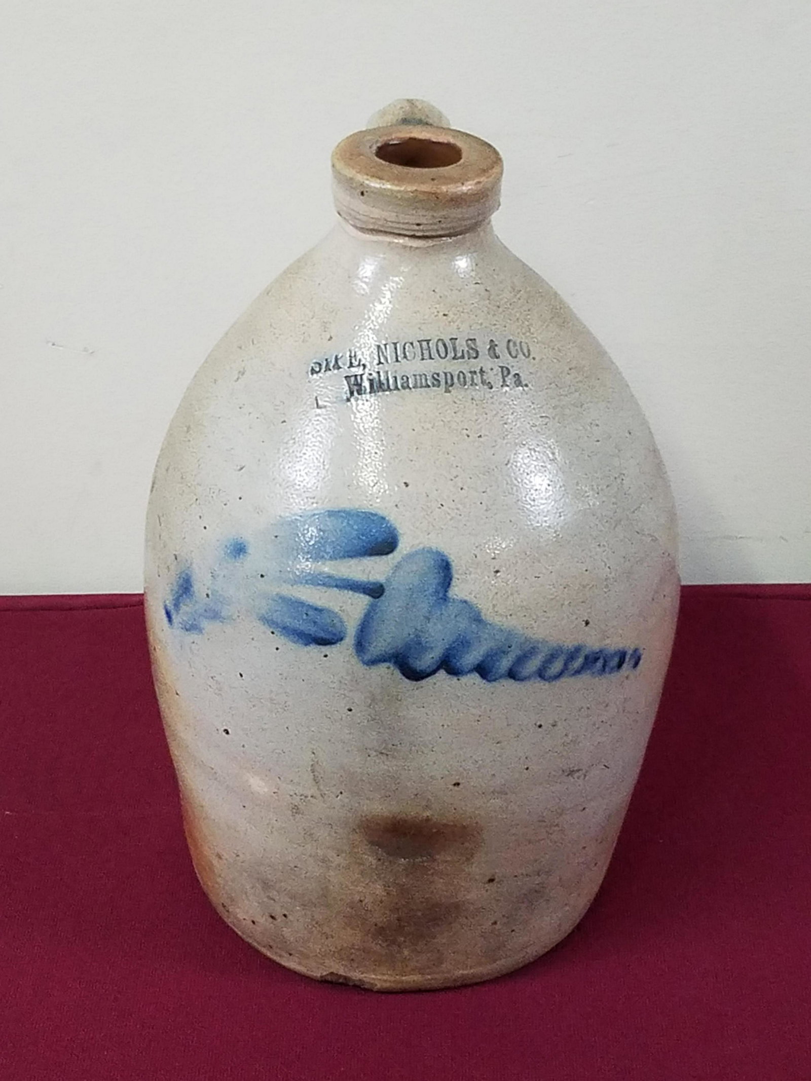 Sipe, Nichols & Co Cobalt Decorated Jug: Williamsport, Pa. 7-1/2" diameter x 11-1/2" high. Chip to bottom rim.