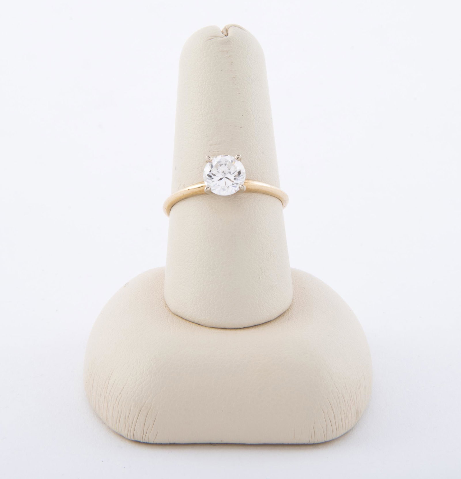 14K & CZ Solitaire: DESCRIPTION: 14k CZ solitaire ring. MEASUREMENTS: Size 7.5. 1.2 dwt.