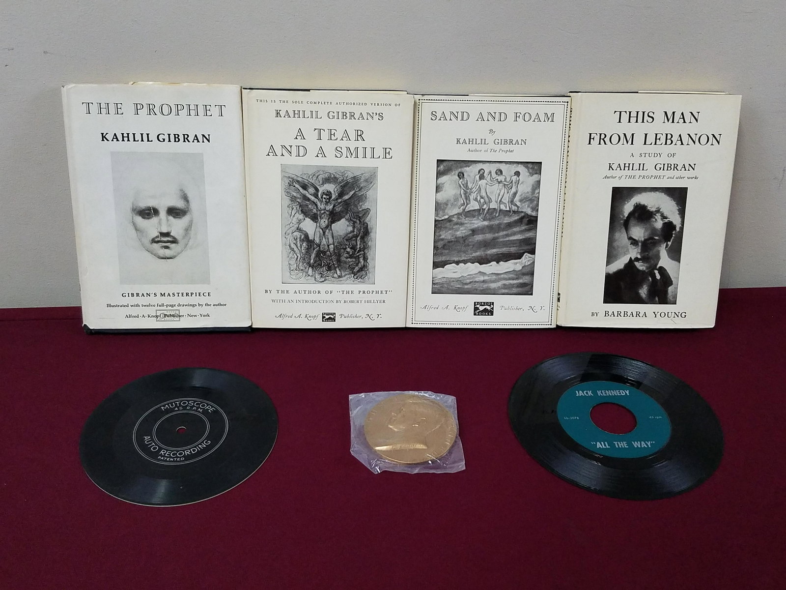 4 K. Gibran Books, JFK Medallion and Records: Includes 4 books by Kahlil Gibran published by Borzoi Books. Also includes JFK medallion, Jack Kennedy "All the Way" record and Mutoscope aito recording record.