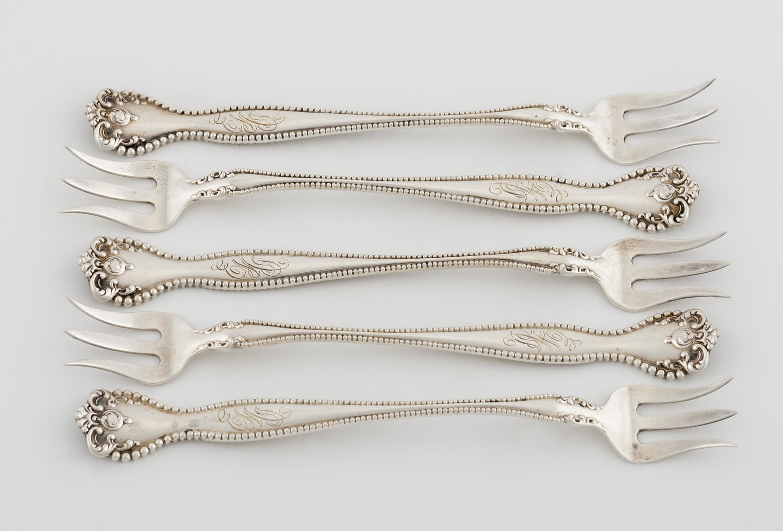 5 Alvin Mfg Co. Raleigh Sterling Seafood Forks: Marked "Sterling" with hallmark. Monogrammed. 5-3/8". 2.56 ozt.